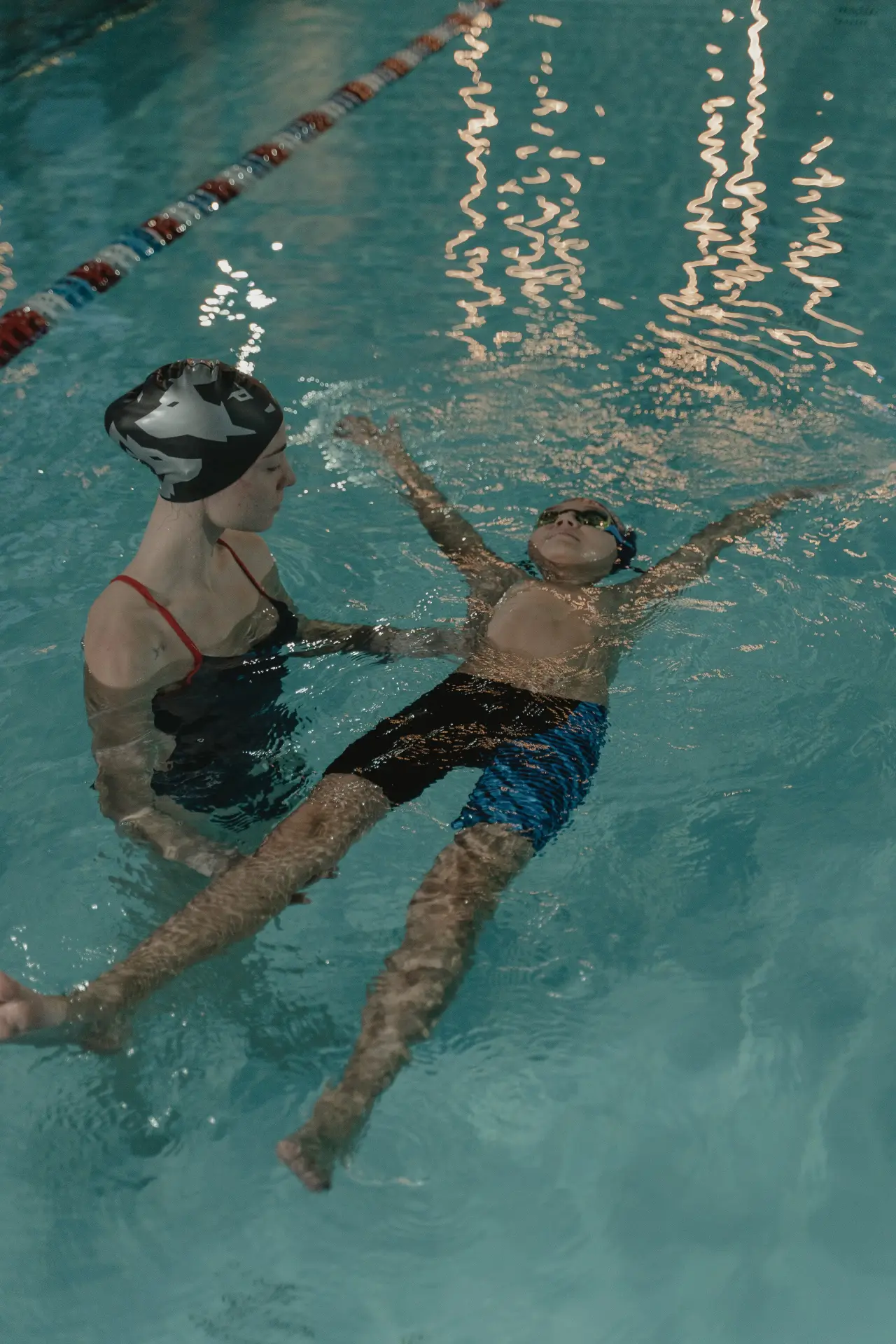 A woman and child in the pool